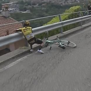 Primoz Roglic crashes, almost topples over road barrier - Cycling video ...