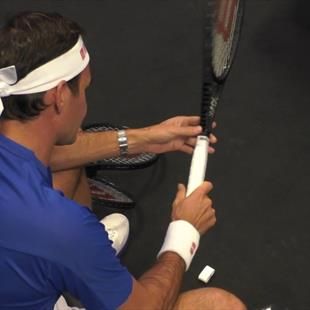 Roger Federer re-grips his racquet backstage ahead of the final match ...