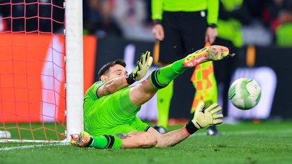 Martinez makes decisive save to send Villa into semis after huge drama