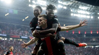 WILD celebrations in Leverkusen after Stanisic equaliser at death preserves unbeaten run